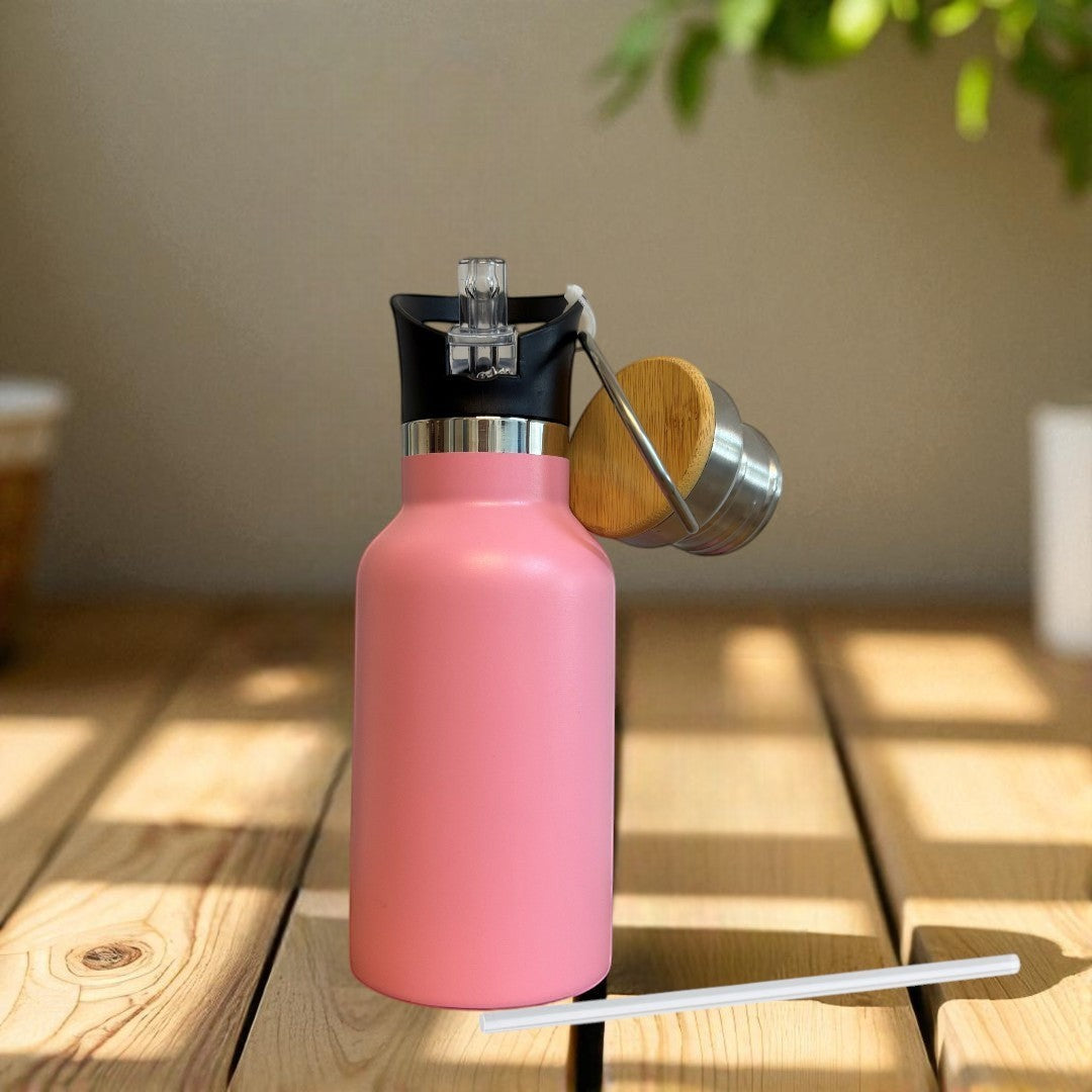 Nomafu 350ml pink stainless steel insulated water bottle with a black sports lid and a bamboo screw cap.