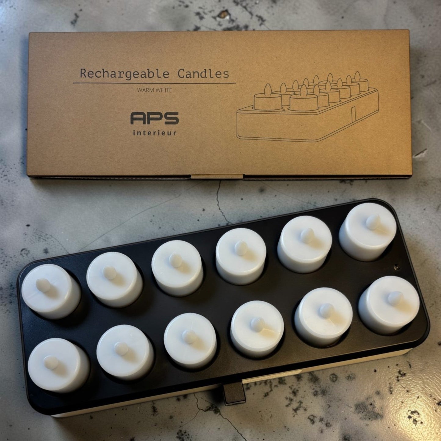 Nomafu set of 12 rechargeable LED tea lights in a black inductive charging base with their original product box.