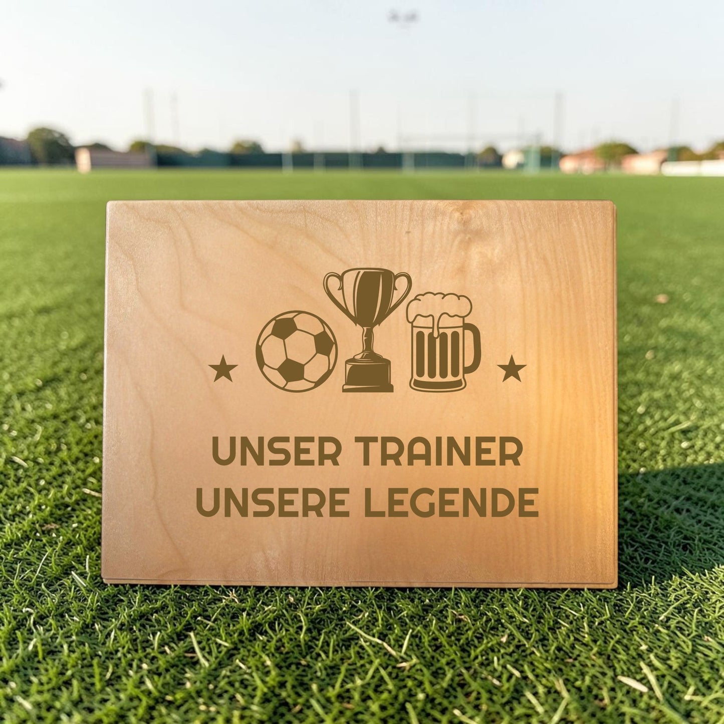 Nomafu wooden crate seat topper with custom laser engraving on a soccer field background