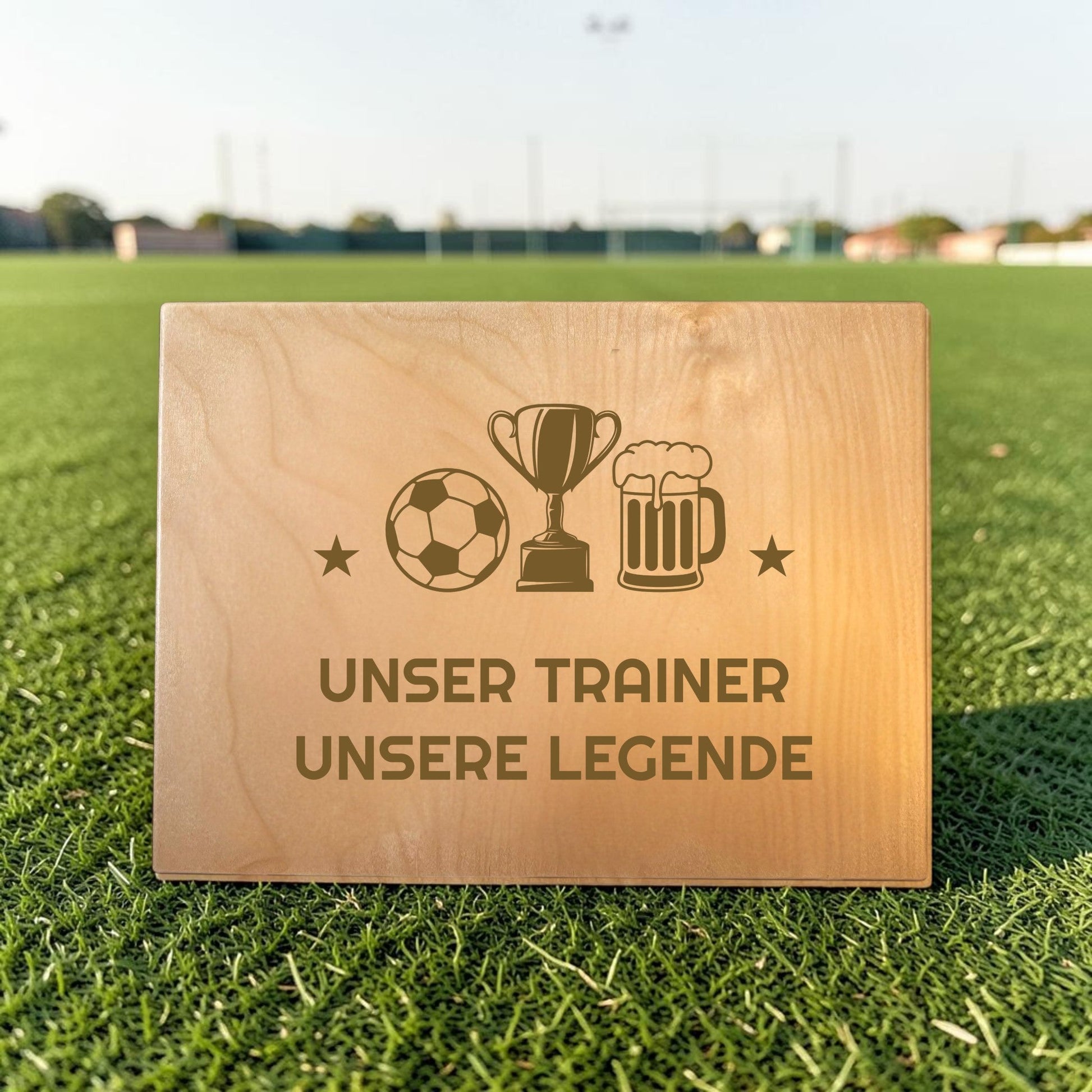 Nomafu wooden crate seat topper with custom laser engraving on a soccer field background